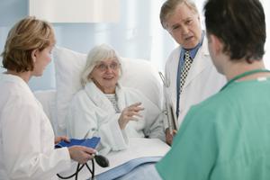 Patient with doctors and nurses